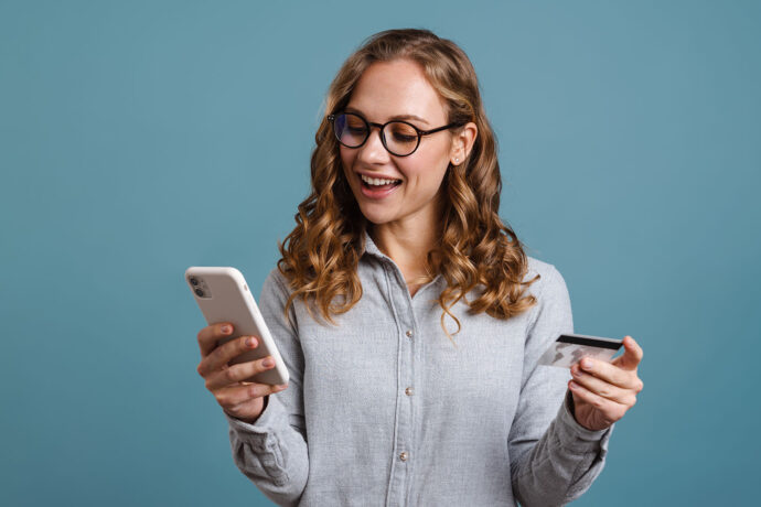 Woman buying weed online with her credit card searching for the cheapest deals on weed online in Canada.